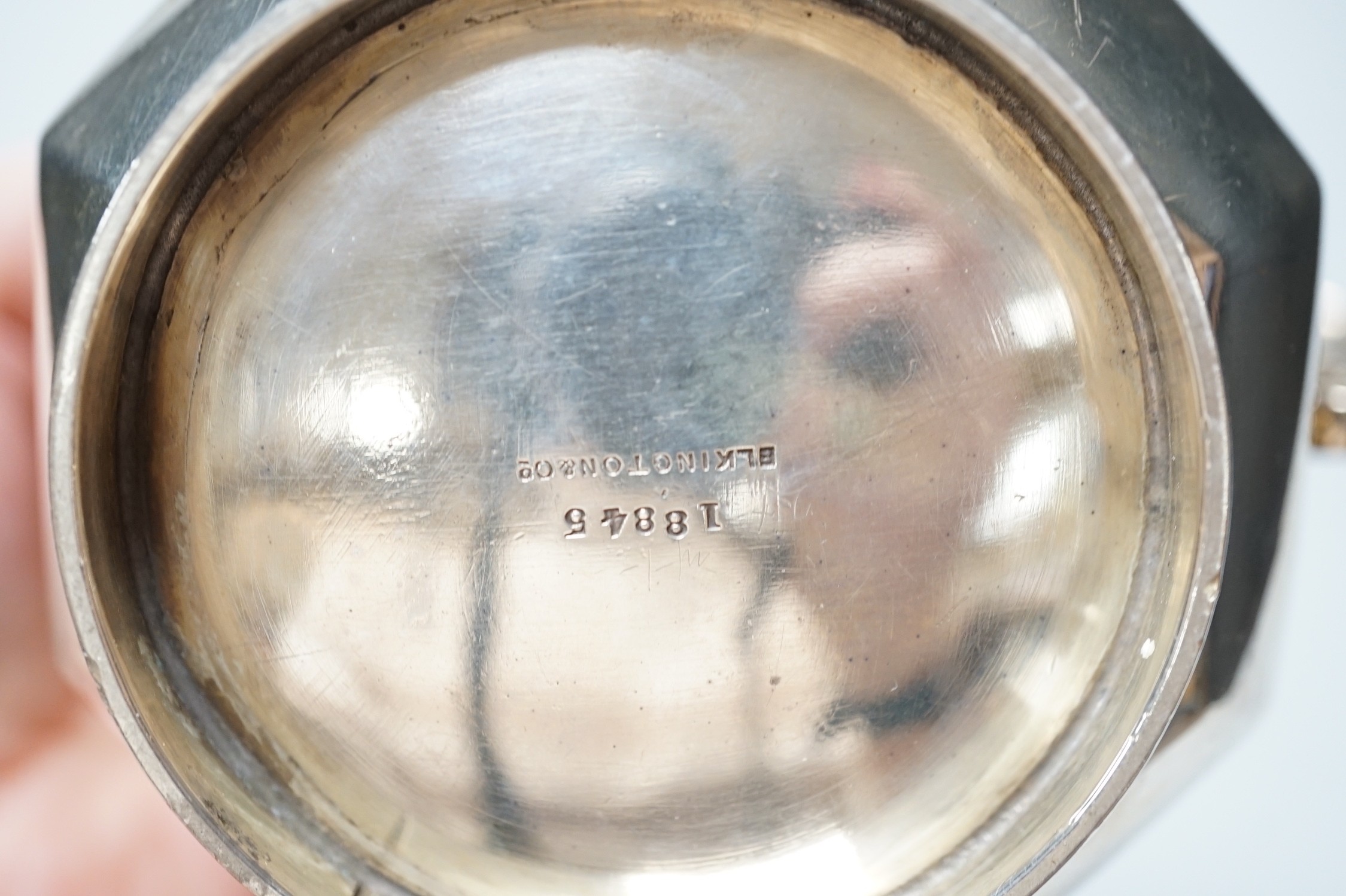 A George V panelled silver cream jug, by Elkington & Co, Birmingham, 1926, height 10cm and a late Victorian silver cream jug, London, 1899, 12.6oz.